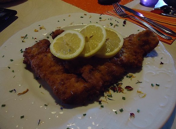 The small schnitzel nearly covered the plate